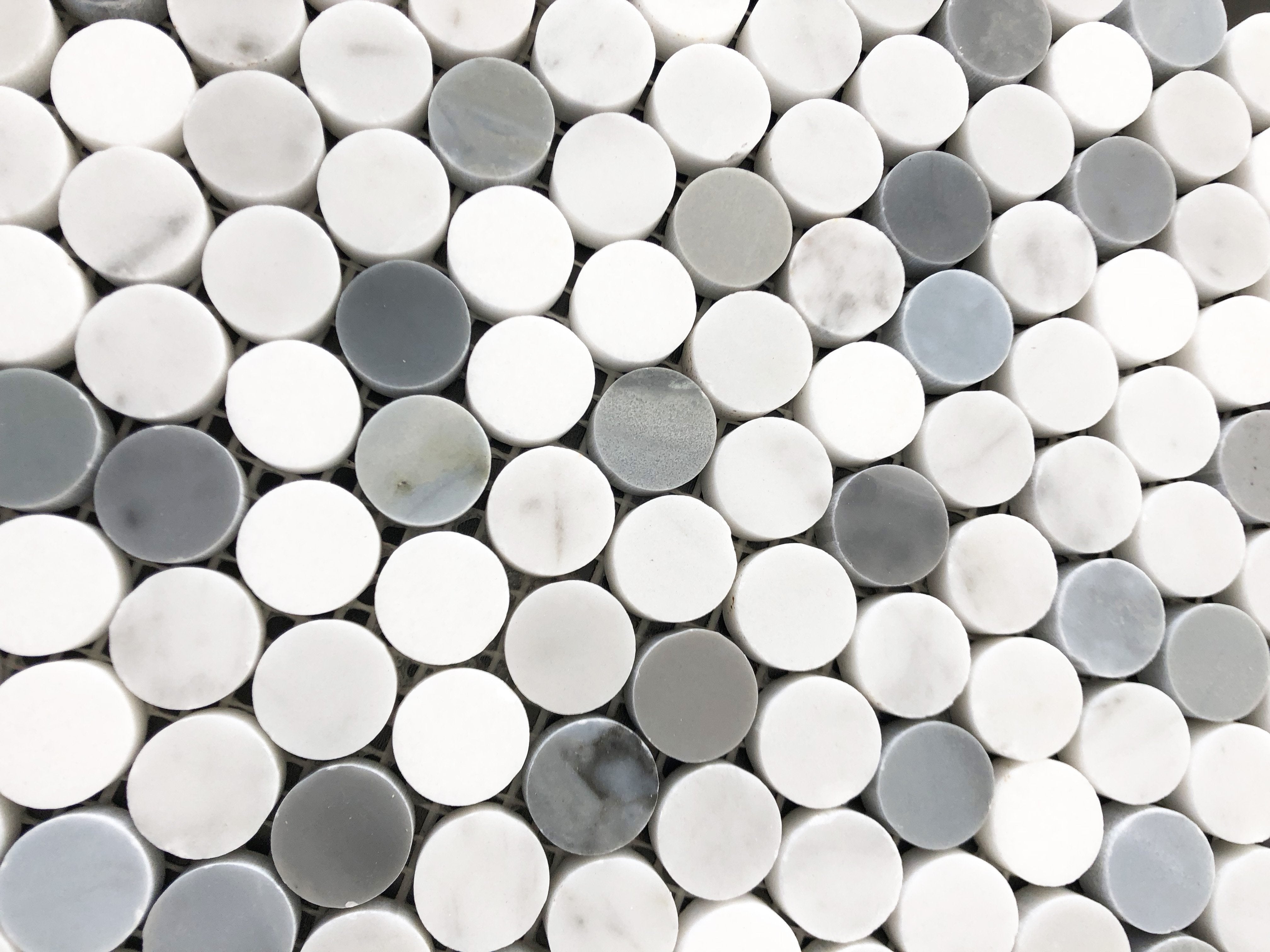Detail of 5/8-inch Carrara penny round tile pattern with natural veining