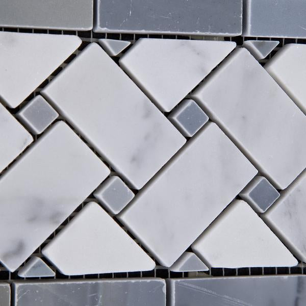 Close-up of basketweave border tile with polished Carrara marble and blue marble dot accents