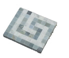 Close-up of Carrara White Marble Greek Key Corner with deep blue inset and polished finish