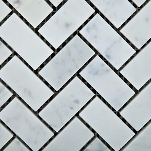 Close-up of Carrara White Herringbone Mosaic 1x2" showing detailed veining and smooth marble texture