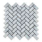Flat view of Carrara White Marble 1x2" Herringbone Mosaic in polished finish, featuring classic white with soft gray veining