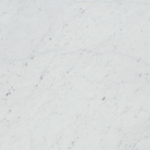 Close-up of Carrara White Marble tile showing soft gray veining on white background