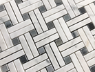 Close-up of Carrara Stanza Mosaic with stacked marble rectangles and blue accents