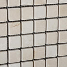 Close-up of Crema Marfil 1x1 mosaic showing polished marble finish