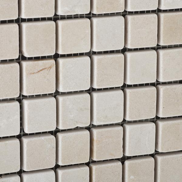 Close-up of Crema Marfil 1x1 mosaic showing polished marble finish