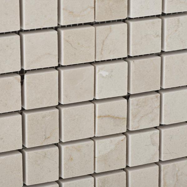 Close-up of Crema Marfil 1x1 mosaic showing polished marble finish