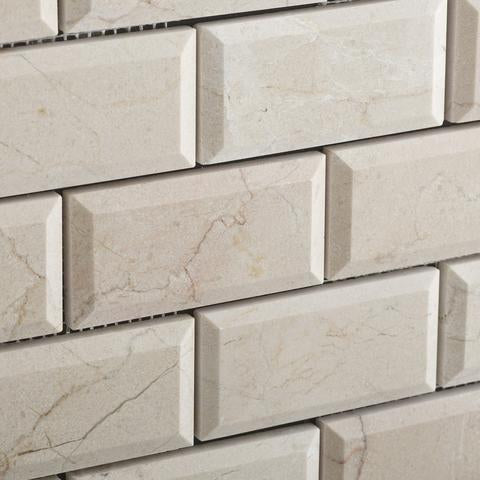 Close-up of Crema Marfil 2x4 mosaic showing bevelled polished edge