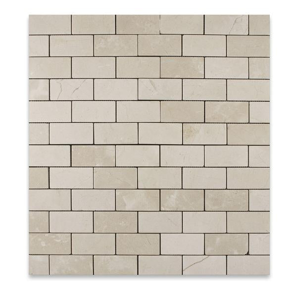 Close-up of Crema Marfil 2x4 polished mosaic showing beige veining