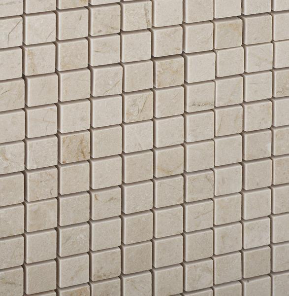 Close-up of Crema Marfil polished 5/8 inch mosaic with reflective finish