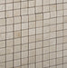 Close-up of Crema Marfil polished 5/8 inch mosaic with reflective finish