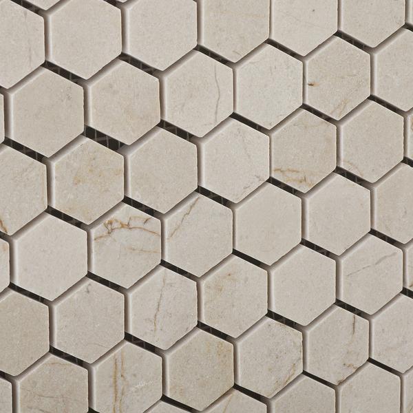 Close-up of polished Crema Marfil marble hexagon mosaic tile