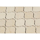 Close-up of Crema Marfil polished lantern mosaic with natural beige veining