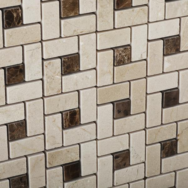 Close-up of Crema Marfil and Emperador marble pinwheel tile showing detail and polish