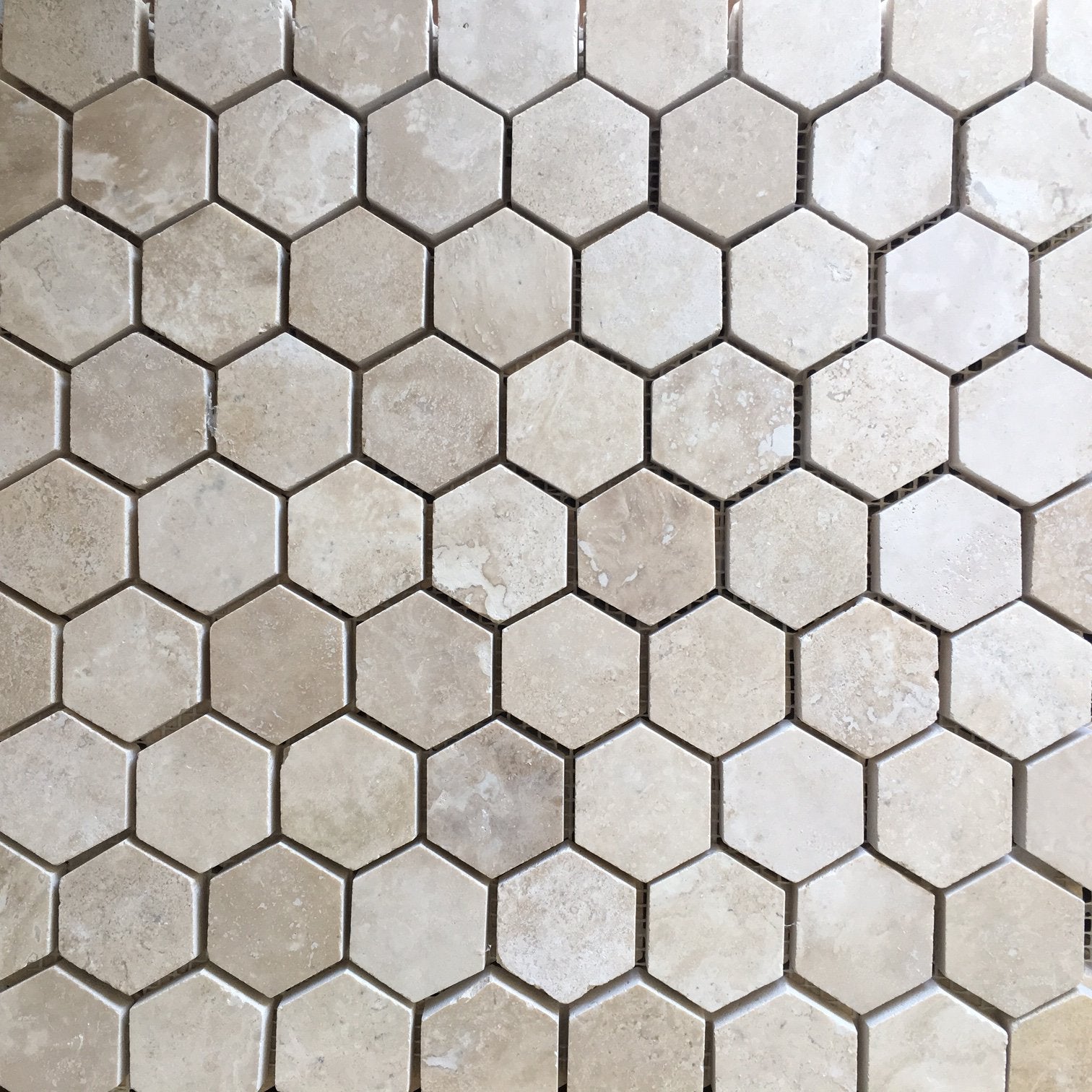 Close-up of Durango 2" hexagon tile showing honed texture and creamy tones