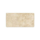 Close-up of Durango Travertine 3x6 showing tumbled texture and veining