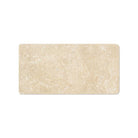 Close-up of Durango Travertine 3x6 showing tumbled texture and veining