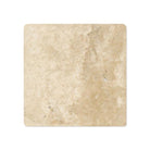 Close-up of tumbled texture and edge of Durango 4x4 travertine tile