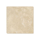 Close-up of tumbled texture and edge of Durango 4x4 travertine tile