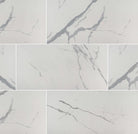 Flat lay of Eden Statuary 24x48 porcelain tile with white base and soft marble veining