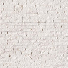 Flat lay of Freska limestone stacked stone panel with alabaster white and beige tones