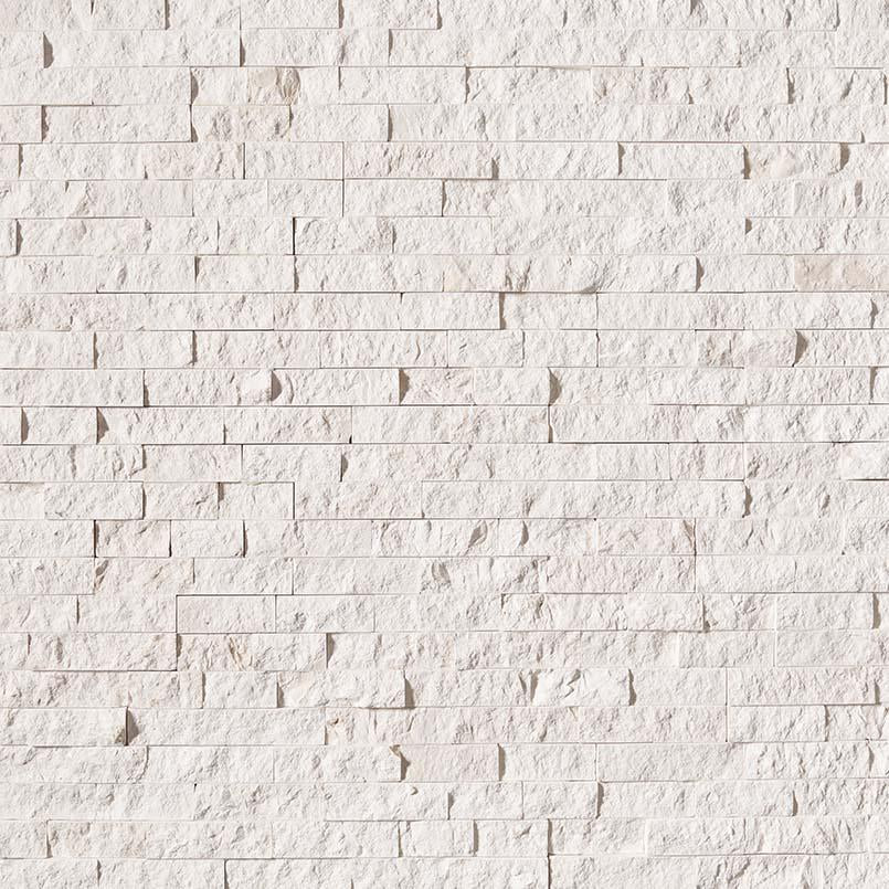 Flat lay of Freska limestone stacked stone panel with alabaster white and beige tones