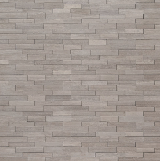 Flat lay view of Gray Oak 3D Mini panels showing honed marble surface and mid-gray tones
