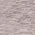 Flat lay of Gray Oak splitface marble stacked stone panel in neutral gray tones