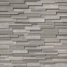 Flat lay of Gray Oak 3D honed marble stacked stone panel in sleek gray tones