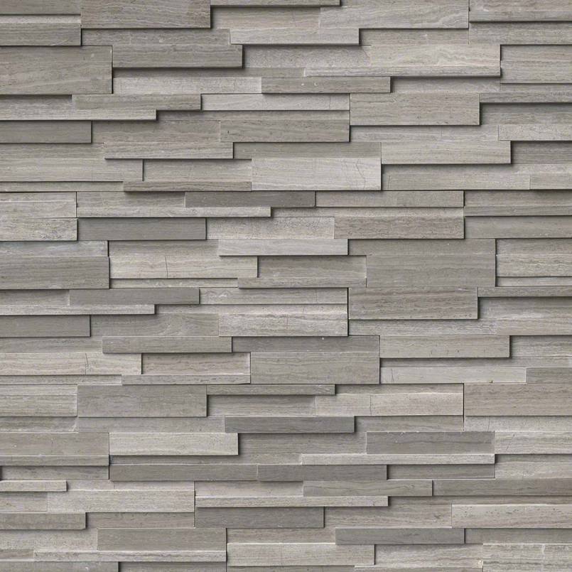 Flat lay of Gray Oak 3D honed marble stacked stone panel in sleek gray tones