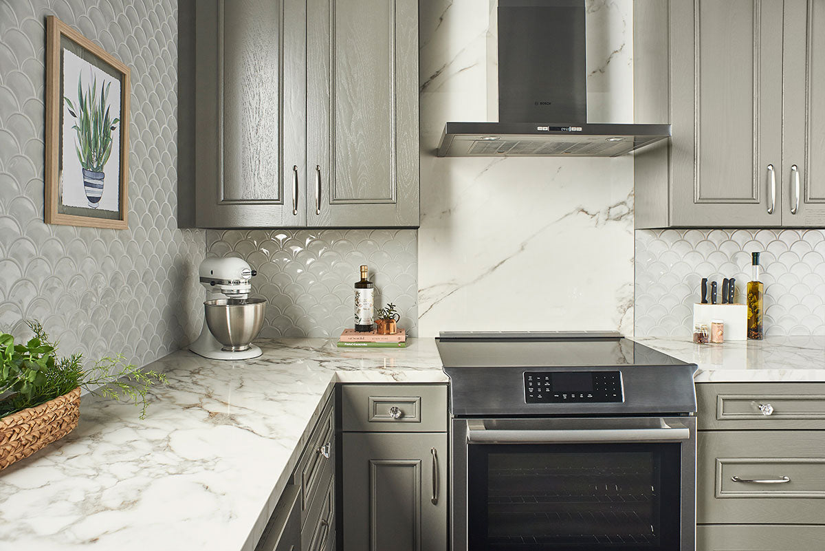 Close-up of porcelain fish scale mosaic in warm gray with smooth glossy finish