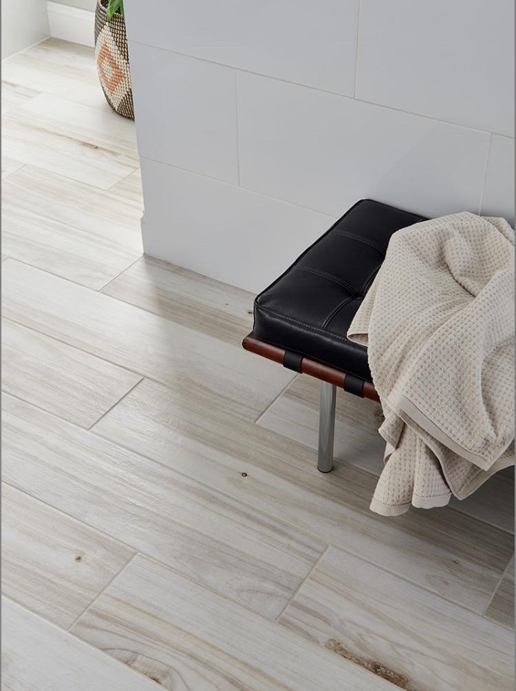 Close-up of Havenwood Dove tile showing natural wood texture and subtle grain variation