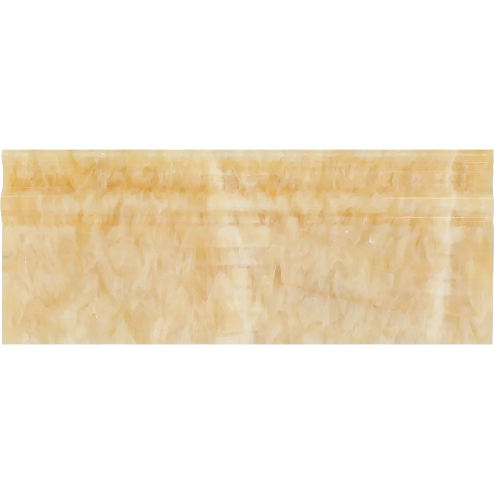 Close-up of Honey Onyx baseboard showing polished surface and veining