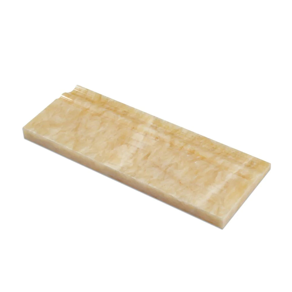 Flat view of Honey Onyx Baseboard Trim in polished finish, 4¾ x 12 inches