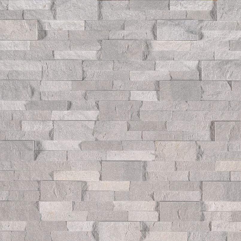 Flat lay of Iceland Gray travertine stacked stone panel in silvery gray tones