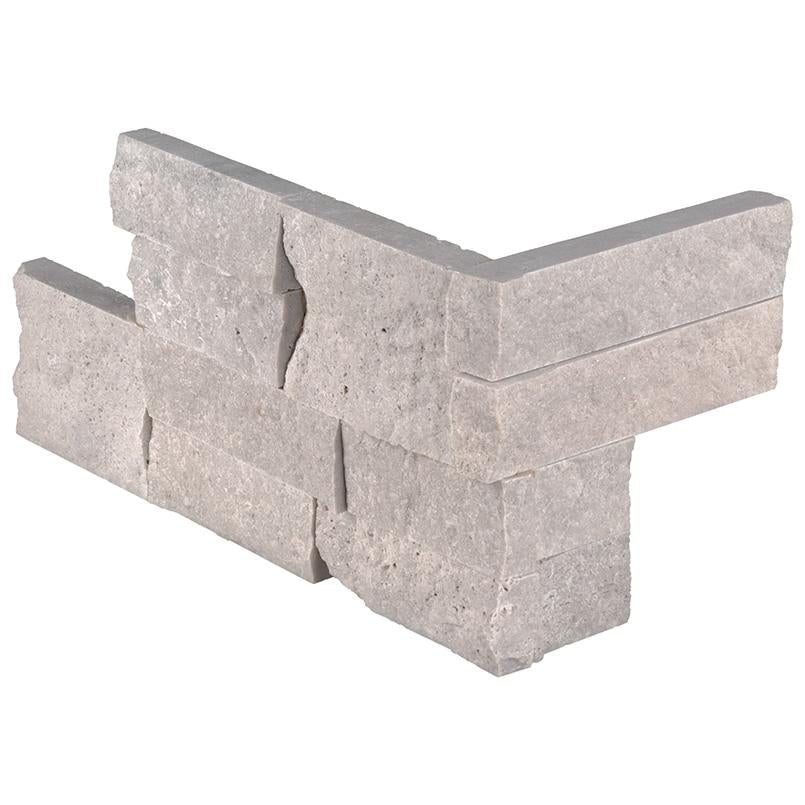 Flat view of Iceland Gray Travertine Stacked Stone Corner in split face finish, 6x18x6