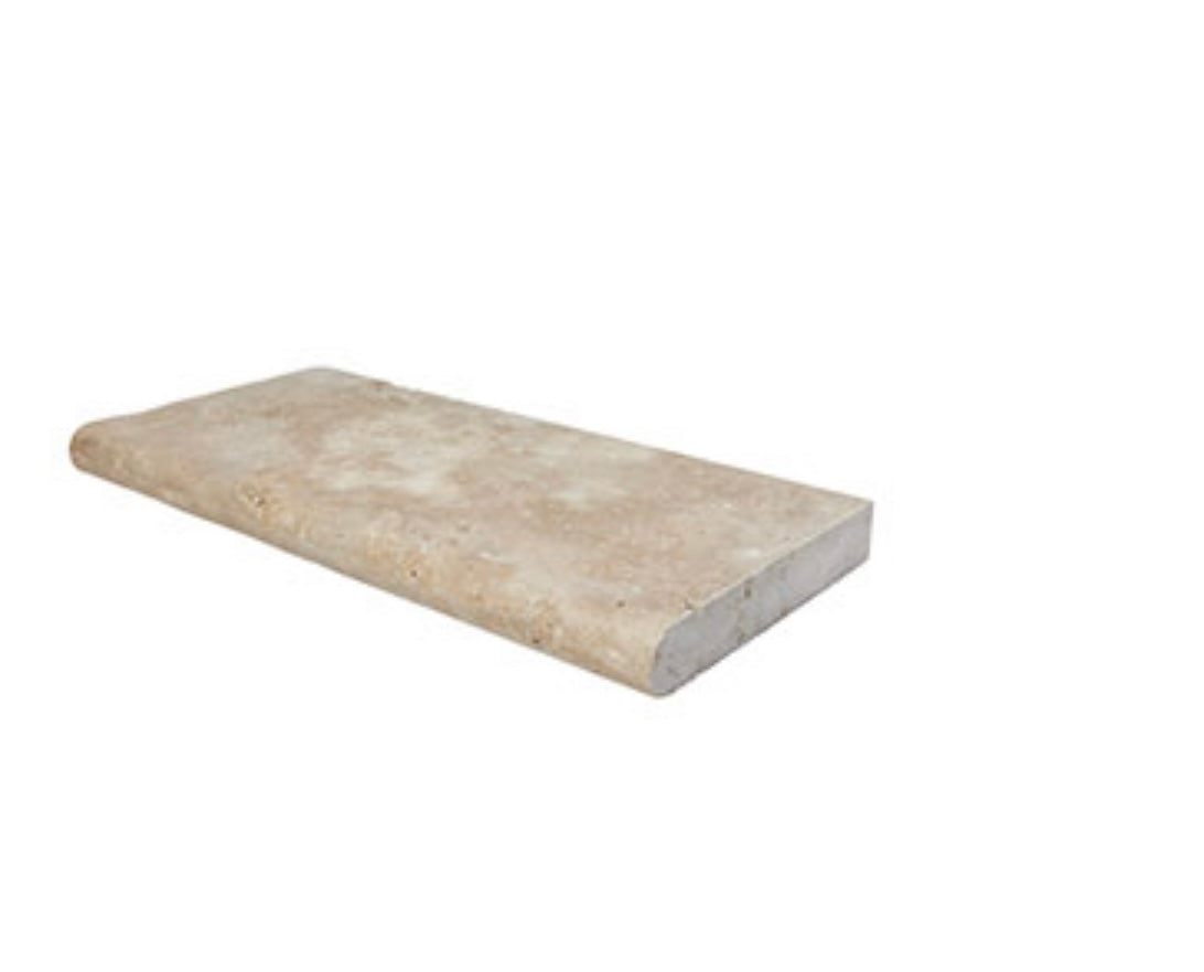 Close-up of Light Walnut Travertine showing natural movement and bullnose edge