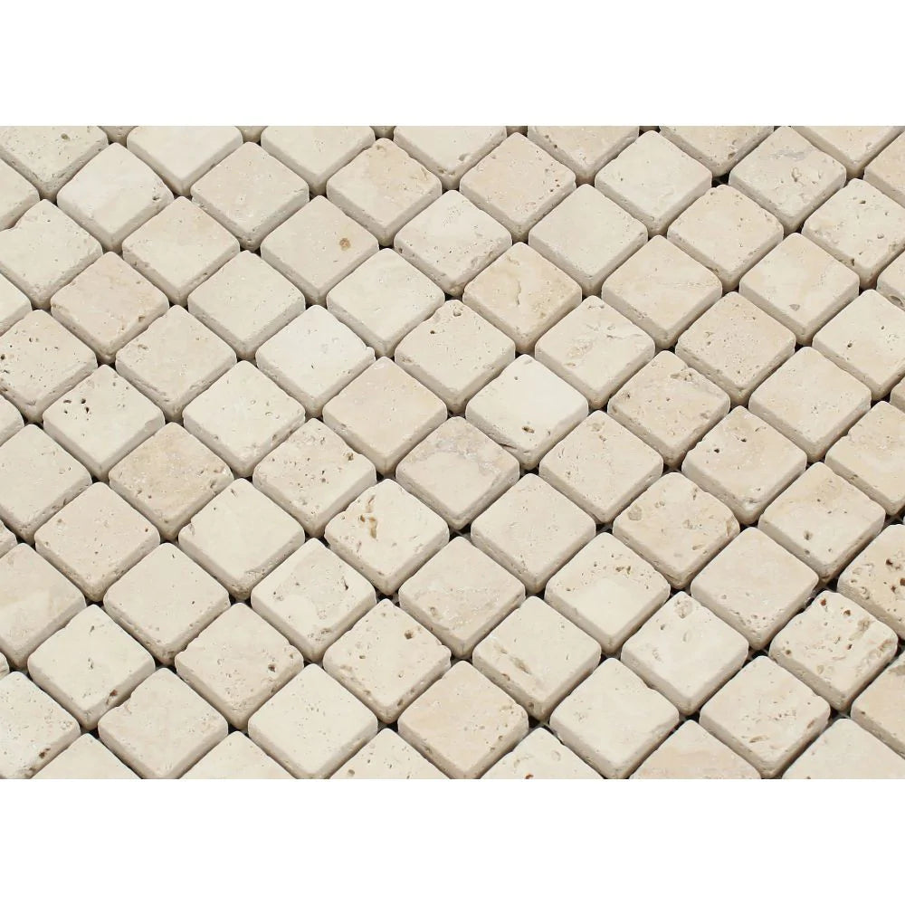 Close-up of Ivory Travertine 1x1 mosaic showing tumbled finish and texture