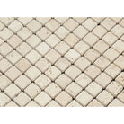 Close-up of Ivory Travertine 1x1 mosaic showing tumbled finish and texture