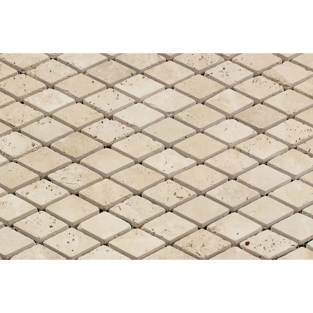 Close-up of Ivory Travertine 1x2 Mosaic showing tumbled texture and soft veining