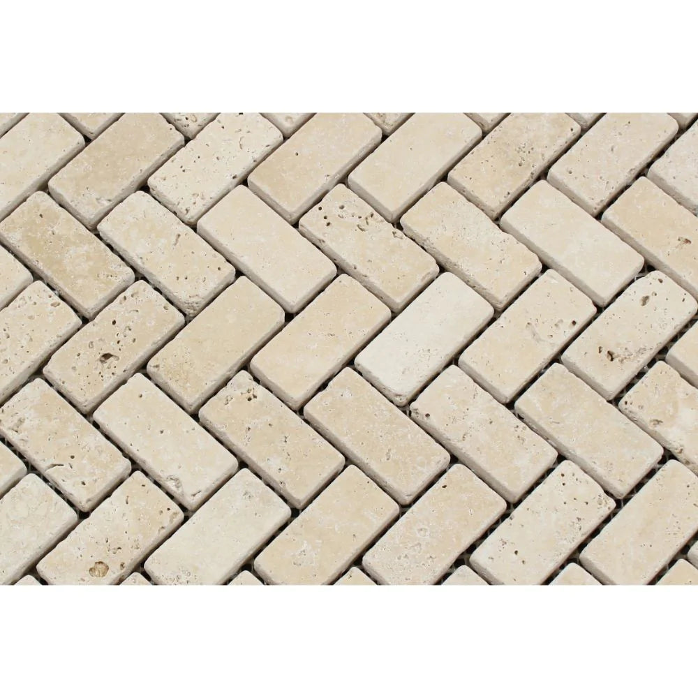 Close-up of Ivory Travertine 1x2 Mosaic showing tumbled texture and soft veining