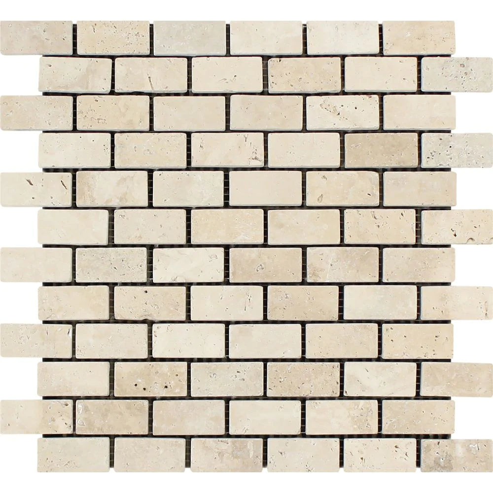 Flat view of Ivory Travertine 1x2 Tumbled Mosaic mounted on mesh sheet