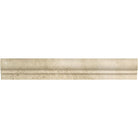 Close-up of Ivory Travertine chair rail molding showing curved profile and soft matte surface