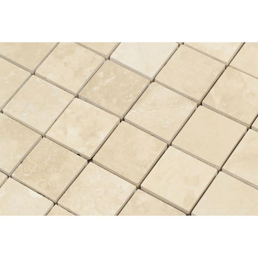Close-up of Ivory Travertine 2x2 mosaic showing honed texture and warm tones
