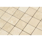 Close-up of Ivory Travertine 2x2 mosaic showing honed texture and warm tones