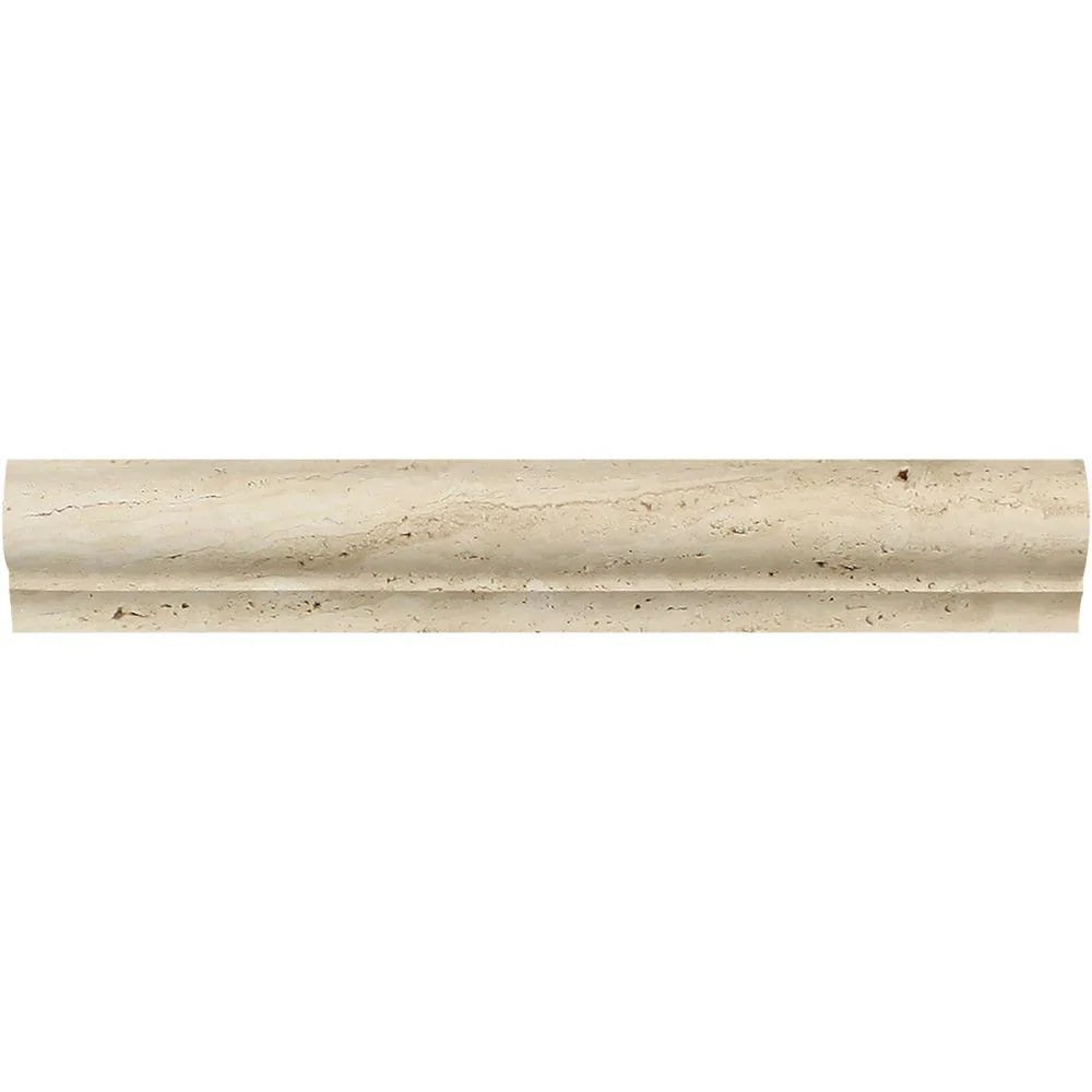 Close-up of Ivory Travertine corner molding showing L-profile and soft matte surface