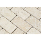 Close-up of Ivory Travertine 2x4 Tumbled Mosaic showing tumbled texture and color variation