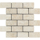 Flat view of Ivory Travertine 2x4 Tumbled Mosaic Tile on mesh sheet in cream and beige tones