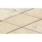 Close-up of Ivory Travertine 3x6 tile showing bevelled edge and smooth surface