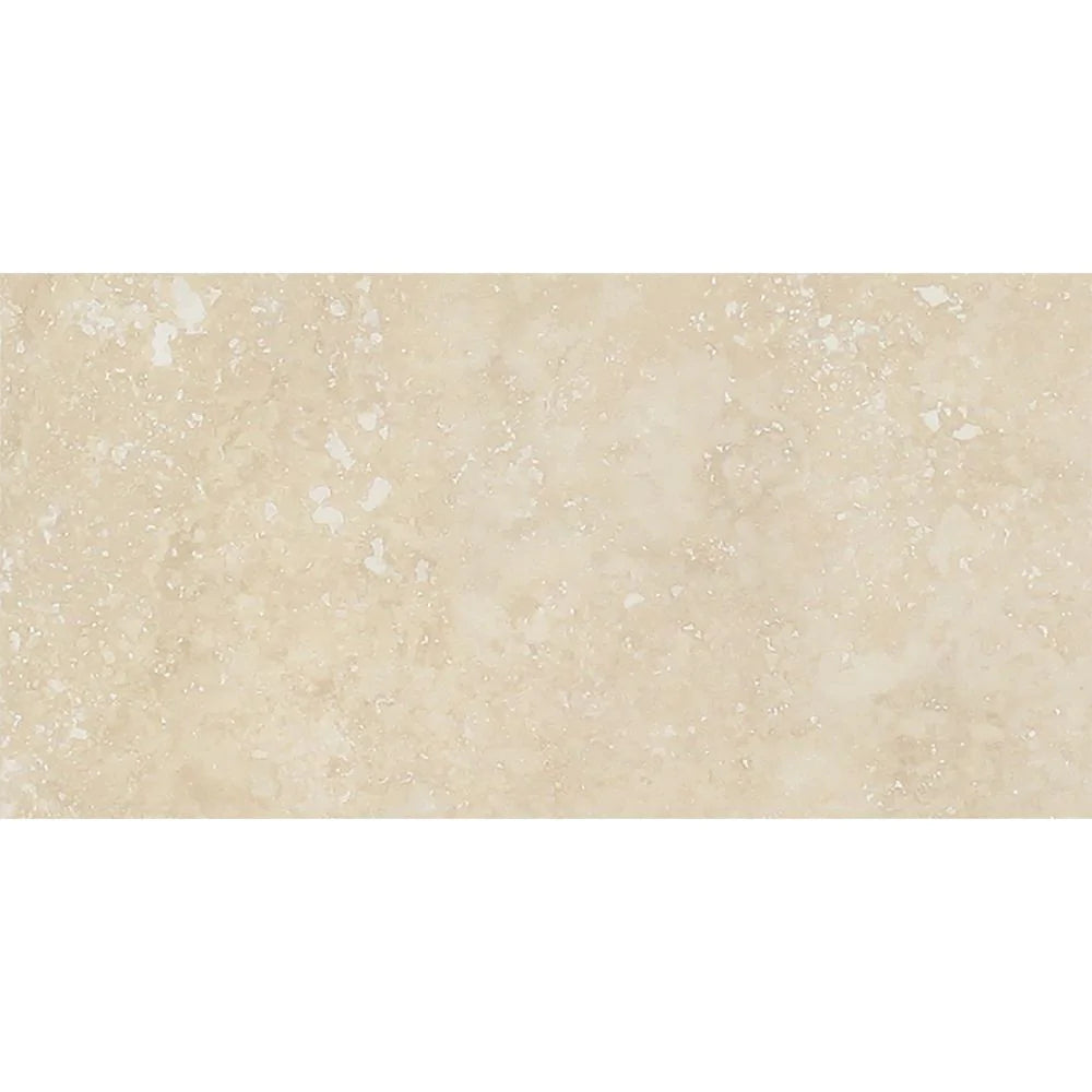 Close-up of Ivory Travertine 3x6 tile showing honed surface and natural texture