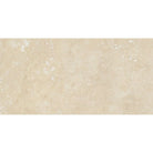 Close-up of Ivory Travertine 3x6 tile showing honed surface and natural texture